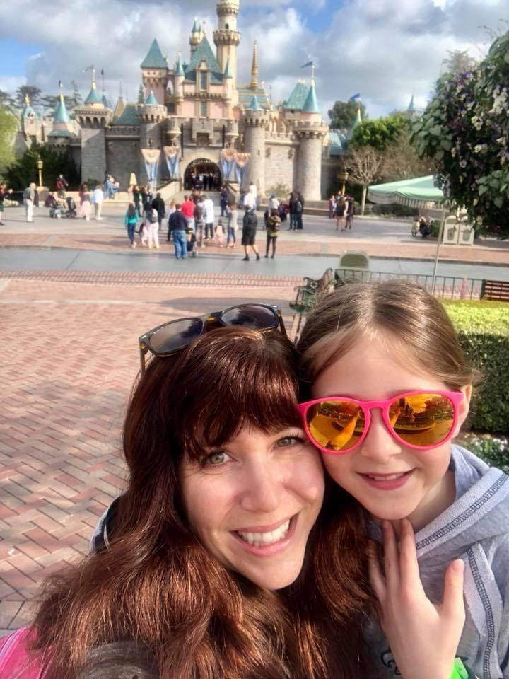 Kat from CityPASS and her daughter outside Sleeping Beauty's Castle